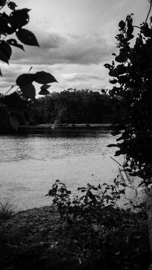 The Poconos Fisherman Boating Black and White Hidden Lake